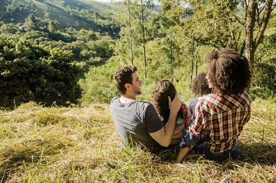 family-sitting-hill-view-from.jpg